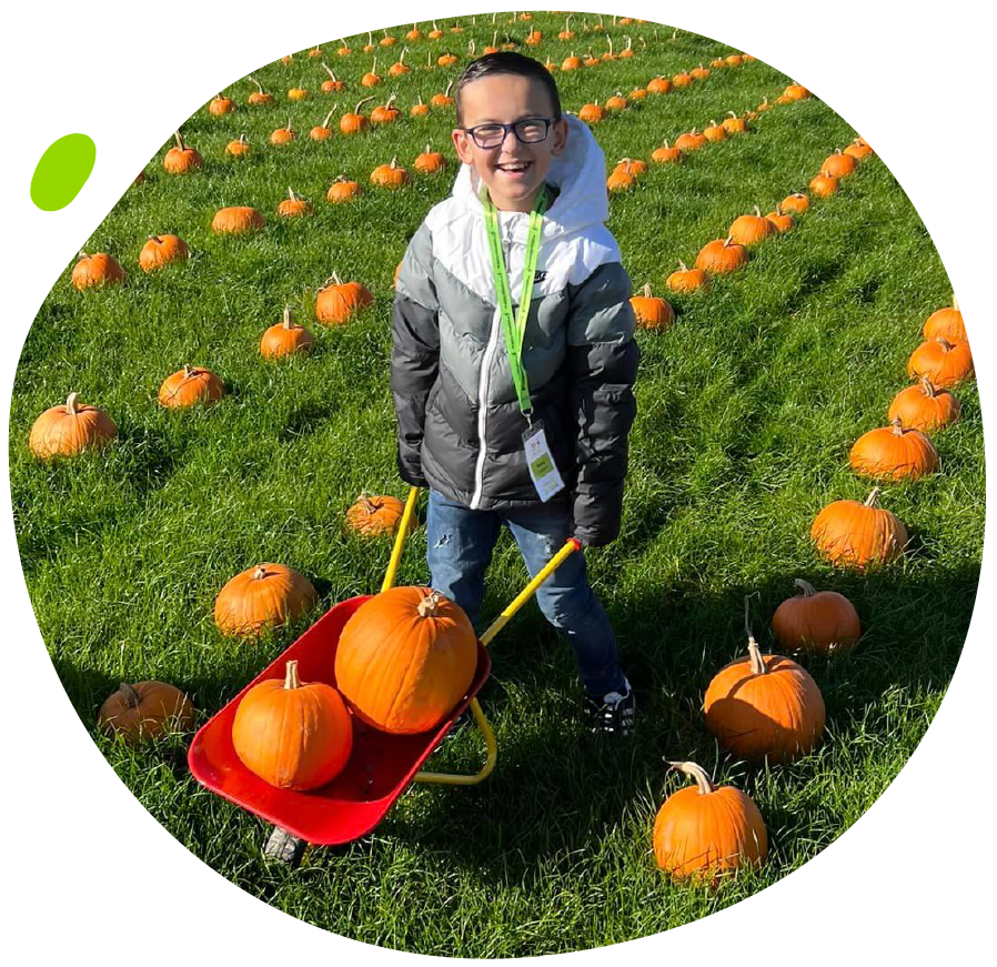 Ronni in a pumpkin field at the My Mito Mission Meetup in 2022
